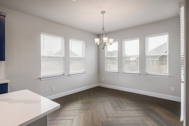2321 Clear Pond Vw, Leander, TX 78641 - unfurnished dining area with baseboards and a chandelier