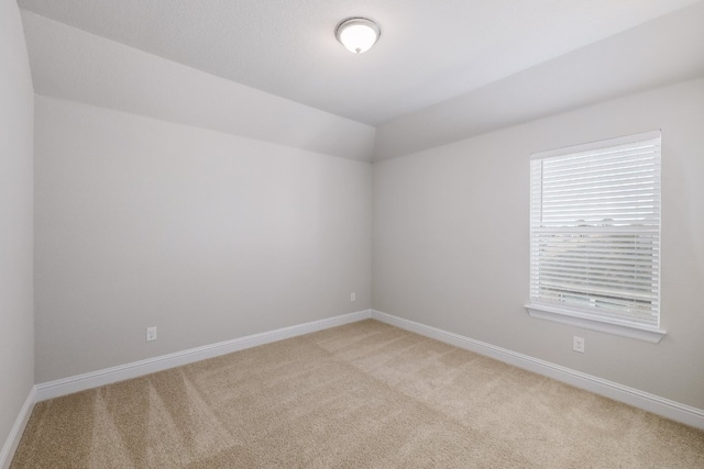 2321 Clear Pond Vw, Leander, TX 78641 - spare room featuring light carpet and vaulted ceiling