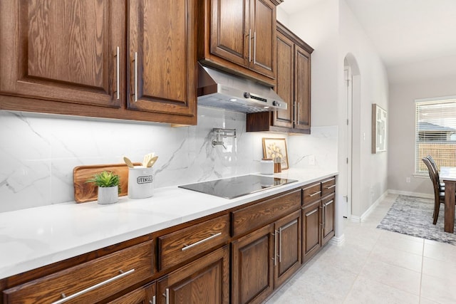 2707 Saint Paul Rivera Ln, Round Rock, TX 78665 - kitchen featuring range hood, black electric cooktop, tasteful backsplash, and light countertops