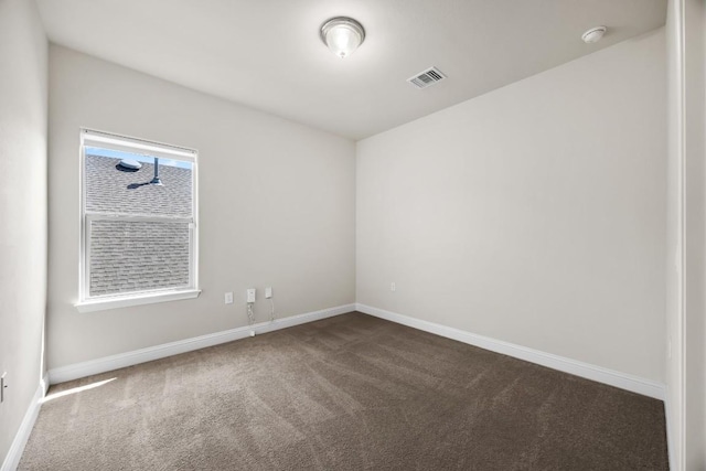 14016 Tyburn Trl, Austin, TX 78717 - unfurnished room featuring dark colored carpet and a smoke detector