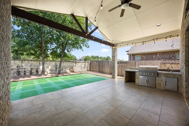14016 Tyburn Trl, Austin, TX 78717 - fenced backyard with area for grilling, ceiling fan, and a patio area