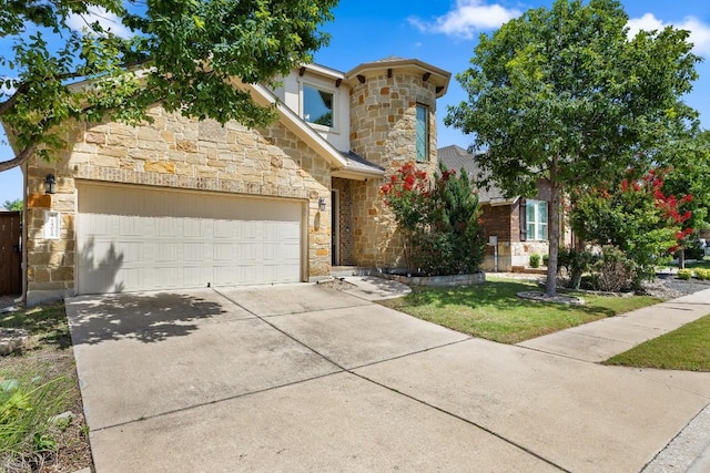 14016 Tyburn Trl, Austin, TX 78717 - view of front of house with stone siding, driveway, an attached garage, and a front yard