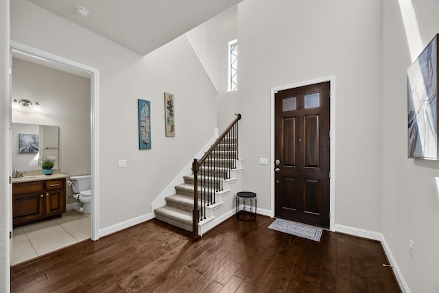 14016 Tyburn Trl, Austin, TX 78717 - entrance foyer with wood finished floors, stairway, and a high ceiling