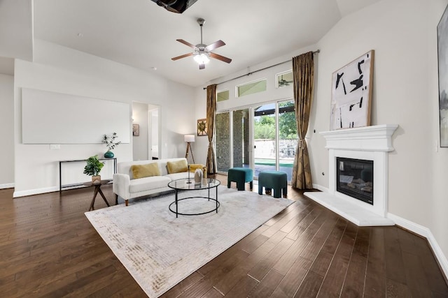 14016 Tyburn Trl, Austin, TX 78717 - living area with a ceiling fan, dark wood-style flooring, and a glass covered fireplace