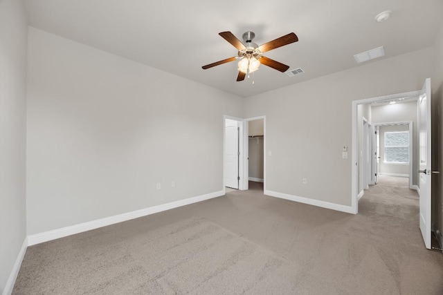14016 Tyburn Trl, Austin, TX 78717 - unfurnished bedroom featuring carpet, a ceiling fan, and a walk in closet