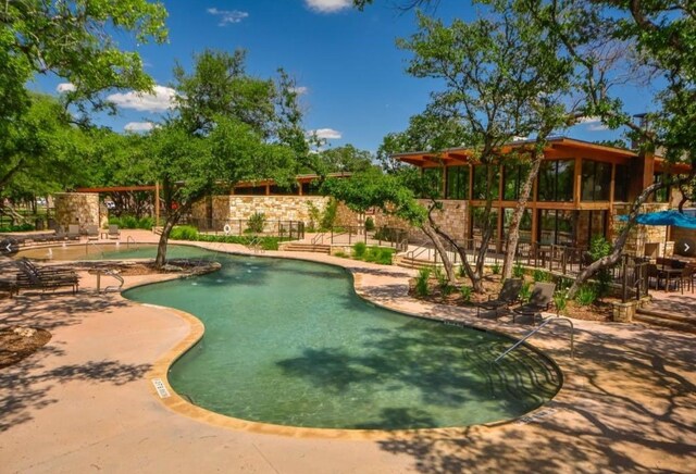 14016 Tyburn Trl, Austin, TX 78717 - view of swimming pool with an area to practice putting and a patio area
