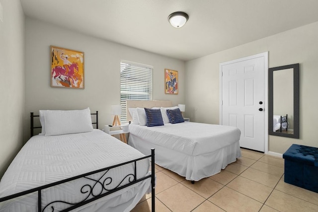 7215 Bennett Ave, Austin, TX 78752 - bedroom featuring light tile patterned floors and baseboards
