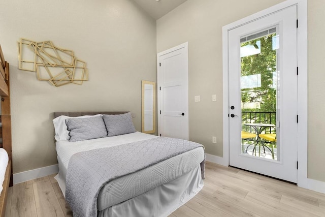 7215 Bennett Ave, Austin, TX 78752 - bedroom with access to exterior, light wood finished floors, and a high ceiling