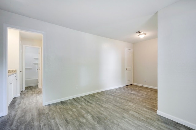 4307 S 1st St Unit 103, Austin, TX 78745 - empty room with wood finished floors and baseboards