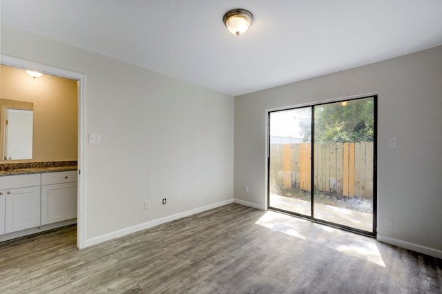 4307 S 1st St Unit 103, Austin, TX 78745 - spare room featuring wood finished floors