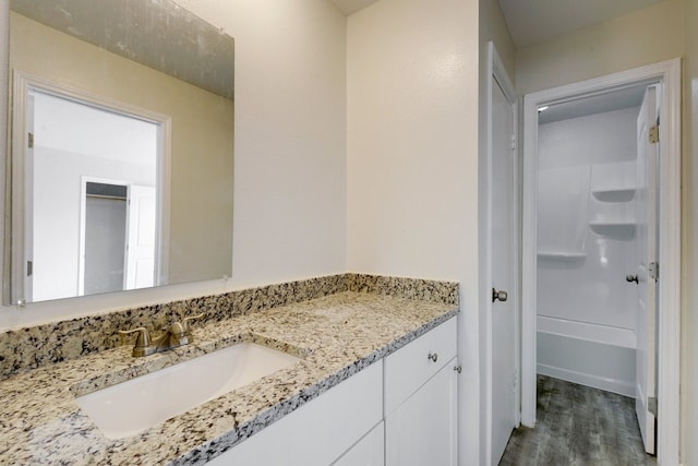 4307 S 1st St Unit 103, Austin, TX 78745 - full bath featuring vanity, wood finished floors, and shower / bath combination