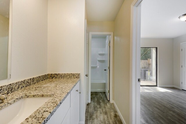 4307 S 1st St Unit 103, Austin, TX 78745 - bathroom with wood finished floors and vanity