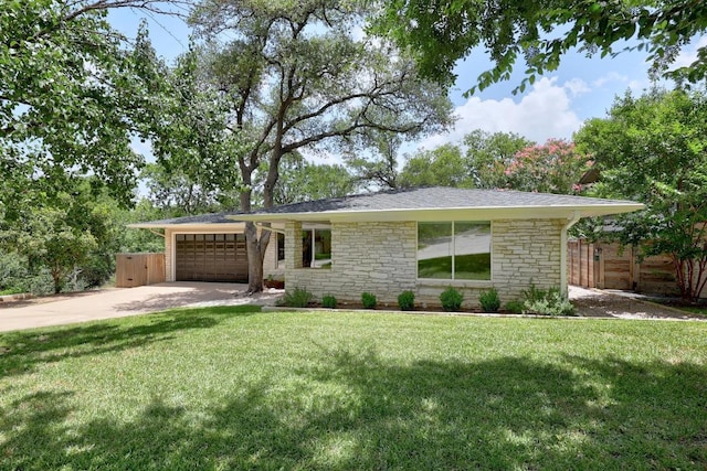 3518 Lakeland Dr, Austin, TX 78731 - view of front of home featuring stone siding, an attached garage, and driveway
