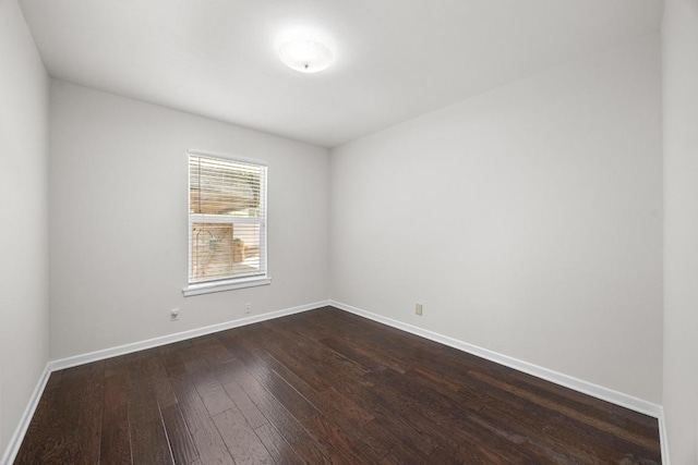 3518 Lakeland Dr, Austin, TX 78731 - unfurnished room with dark wood-style floors and baseboards