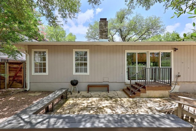 3518 Lakeland Dr, Austin, TX 78731 - back of property with a chimney and a patio