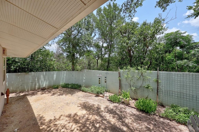 3518 Lakeland Dr, Austin, TX 78731 - fenced backyard featuring a patio area and view of scattered trees