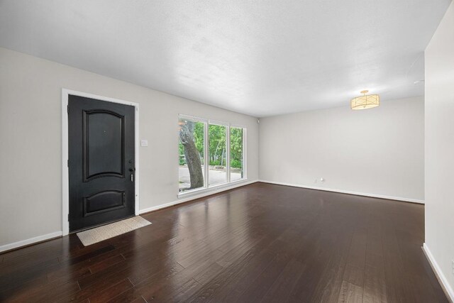 3518 Lakeland Dr, Austin, TX 78731 - unfurnished living room featuring wood finished floors and baseboards
