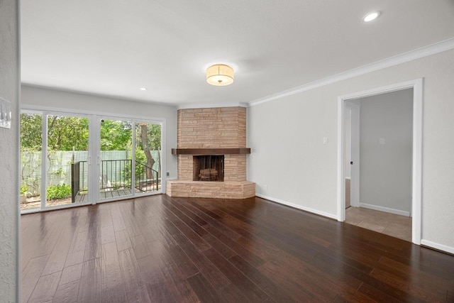 3518 Lakeland Dr, Austin, TX 78731 - unfurnished living room featuring wood finished floors, a fireplace, crown molding, and recessed lighting