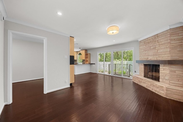 3518 Lakeland Dr, Austin, TX 78731 - unfurnished living room featuring wood finished floors, a stone fireplace, and recessed lighting