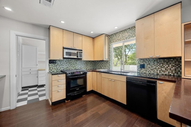 3518 Lakeland Dr, Austin, TX 78731 - kitchen featuring black appliances, light brown cabinets, dark countertops, and recessed lighting