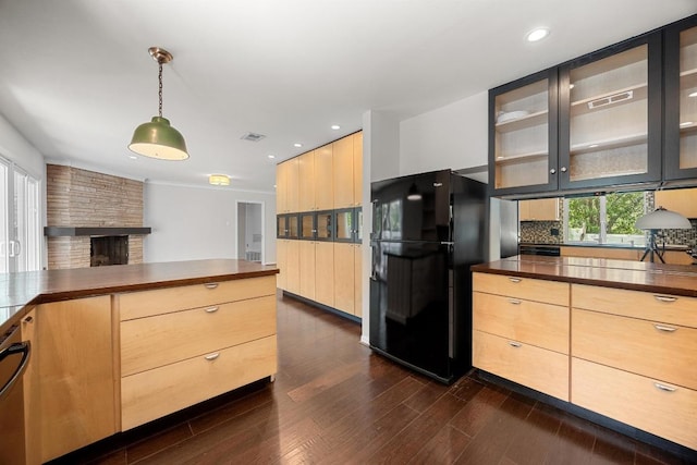 3518 Lakeland Dr, Austin, TX 78731 - kitchen with freestanding refrigerator, light brown cabinets, glass insert cabinets, decorative backsplash, and dark wood-style floors