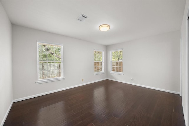 3518 Lakeland Dr, Austin, TX 78731 - spare room featuring healthy amount of natural light and dark wood-style floors