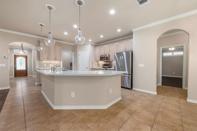 811 River Walk Trl, Georgetown, TX 78633 - kitchen featuring arched walkways, stainless steel appliances, decorative backsplash, light countertops, and crown molding