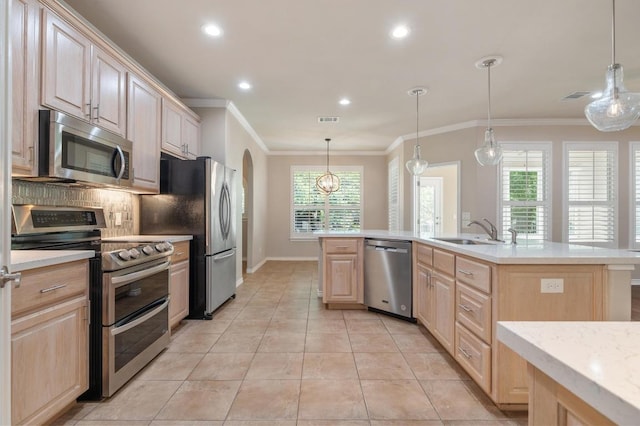 811 River Walk Trl, Georgetown, TX 78633 - kitchen with appliances with stainless steel finishes, light brown cabinetry, ornamental molding, recessed lighting, and light tile patterned floors