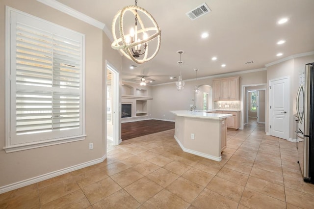 811 River Walk Trl, Georgetown, TX 78633 - kitchen featuring crown molding, open floor plan, recessed lighting, light countertops, and light tile patterned floors