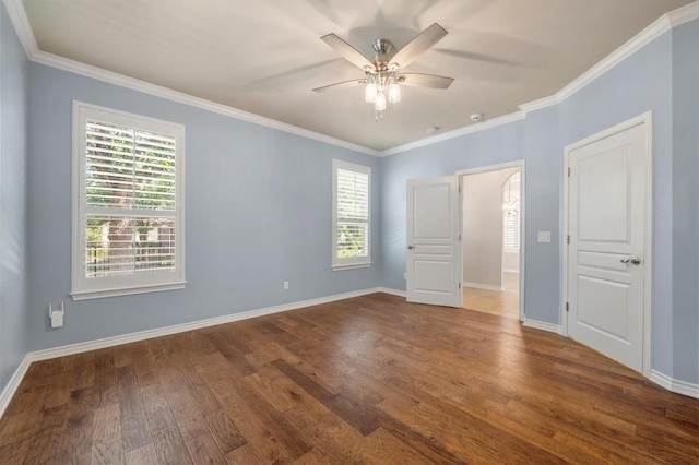 811 River Walk Trl, Georgetown, TX 78633 - empty room with dark wood-style flooring, plenty of natural light, a ceiling fan, and ornamental molding
