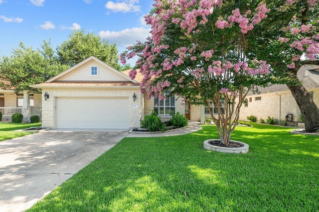 811 River Walk Trl, Georgetown, TX 78633 - view of front of home with a garage, concrete driveway, a front yard, and stone siding