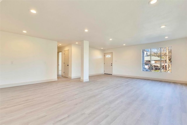 214 Jackman St, San Marcos, TX 78666 - unfurnished living room featuring recessed lighting and light wood-style floors