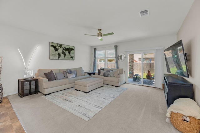 136 Everglades Ave, Taylor, TX 76574 - living area with ceiling fan and carpet flooring