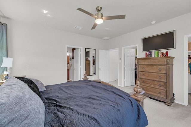 136 Everglades Ave, Taylor, TX 76574 - bedroom featuring light colored carpet, ceiling fan, and connected bathroom