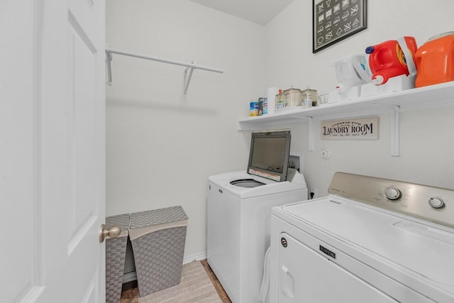 136 Everglades Ave, Taylor, TX 76574 - laundry area with washer and clothes dryer