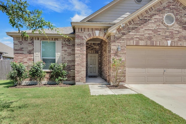 136 Everglades Ave, Taylor, TX 76574 - view of front of home with brick siding, an attached garage, and concrete driveway