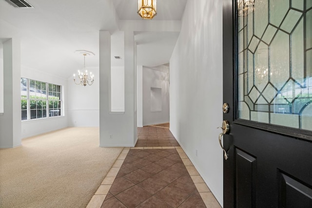 4917 Flaming Oak Cv, Austin, TX 78749 - foyer entrance featuring a chandelier and tile patterned flooring