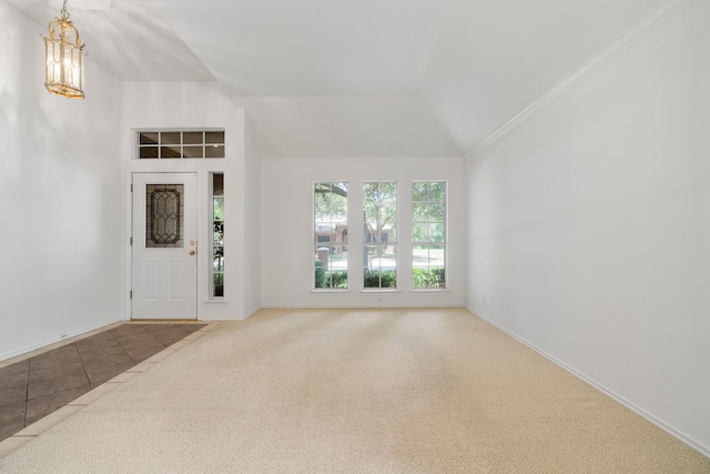 4917 Flaming Oak Cv, Austin, TX 78749 - foyer entrance with carpet flooring, vaulted ceiling, and tile patterned flooring
