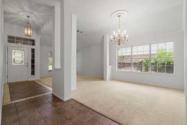 4917 Flaming Oak Cv, Austin, TX 78749 - carpeted entrance foyer with a chandelier, tile patterned flooring, and ornamental molding