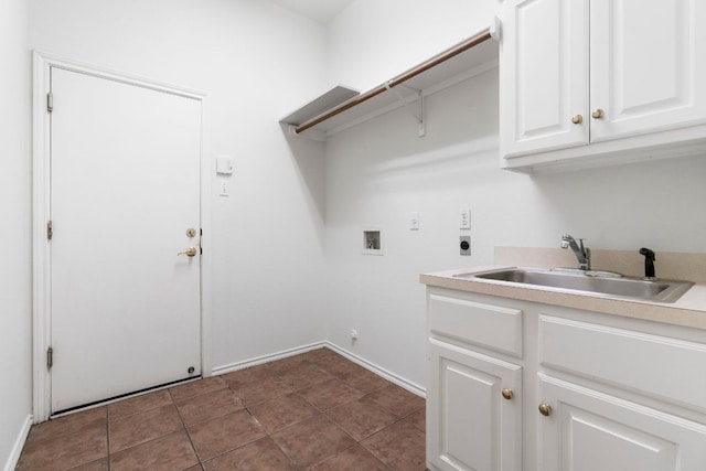 4917 Flaming Oak Cv, Austin, TX 78749 - laundry area featuring hookup for an electric dryer, washer hookup, and cabinet space