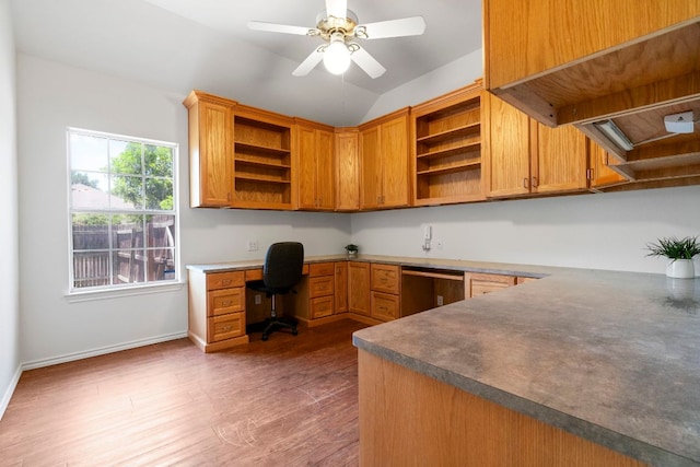 4917 Flaming Oak Cv, Austin, TX 78749 - office area featuring built in study area, wood finished floors, ceiling fan, and lofted ceiling