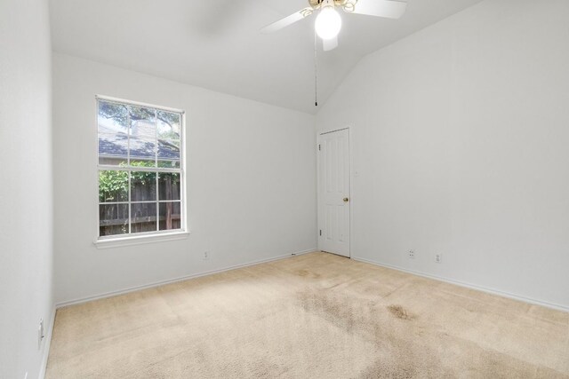 4917 Flaming Oak Cv, Austin, TX 78749 - carpeted empty room featuring lofted ceiling and ceiling fan