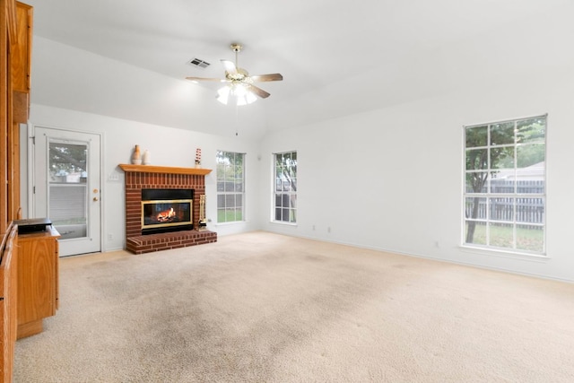 4917 Flaming Oak Cv, Austin, TX 78749 - unfurnished living room with a fireplace, a ceiling fan, light carpet, and vaulted ceiling