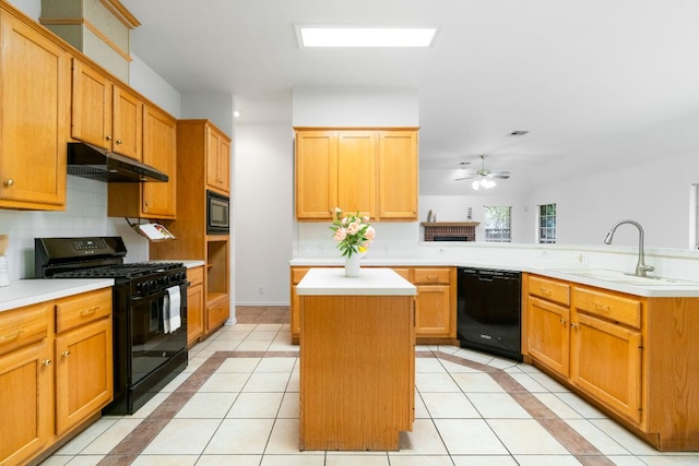 4917 Flaming Oak Cv, Austin, TX 78749 - kitchen featuring black appliances, under cabinet range hood, light tile patterned floors, and tasteful backsplash