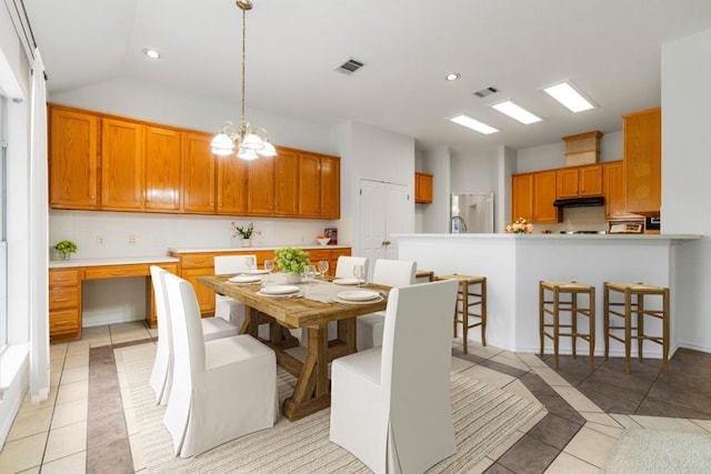 4917 Flaming Oak Cv, Austin, TX 78749 - dining space featuring light tile patterned flooring, recessed lighting, a chandelier, and lofted ceiling