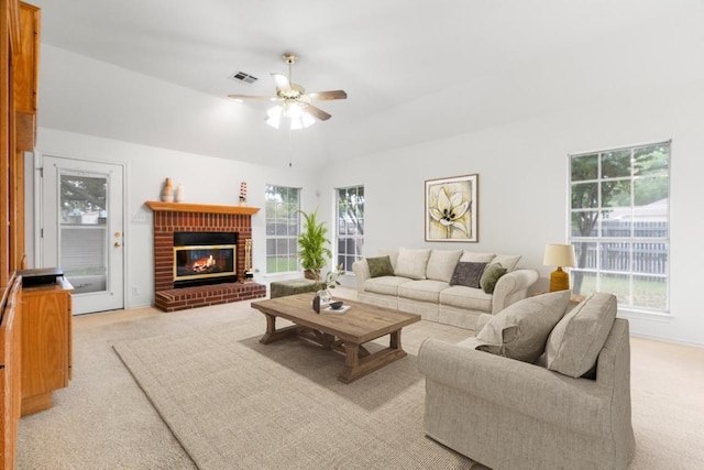 4917 Flaming Oak Cv, Austin, TX 78749 - living room with light colored carpet, ceiling fan, a fireplace, and lofted ceiling