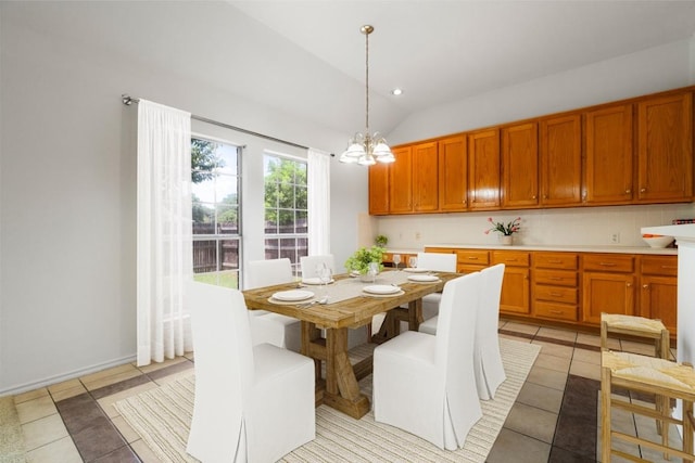 4917 Flaming Oak Cv, Austin, TX 78749 - dining room featuring light tile patterned flooring, a chandelier, and lofted ceiling