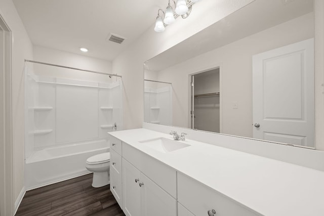 701 Redfish Ln, Hutto, TX 78634 - bathroom with vanity, wood finished floors, shower / bath combination, and recessed lighting
