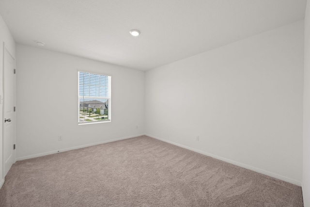 701 Redfish Ln, Hutto, TX 78634 - empty room with carpet floors and baseboards