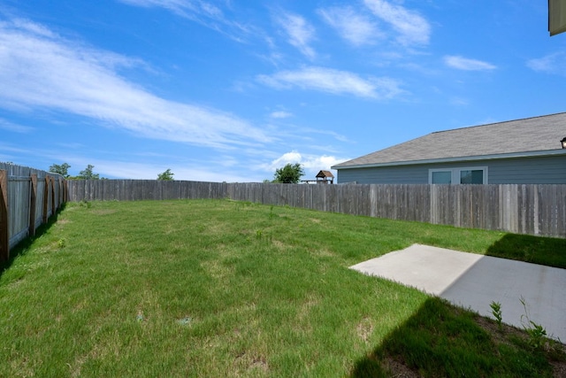 701 Redfish Ln, Hutto, TX 78634 - fenced backyard with a patio